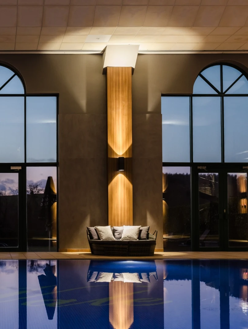 A pool and loungers at a hotel health club.