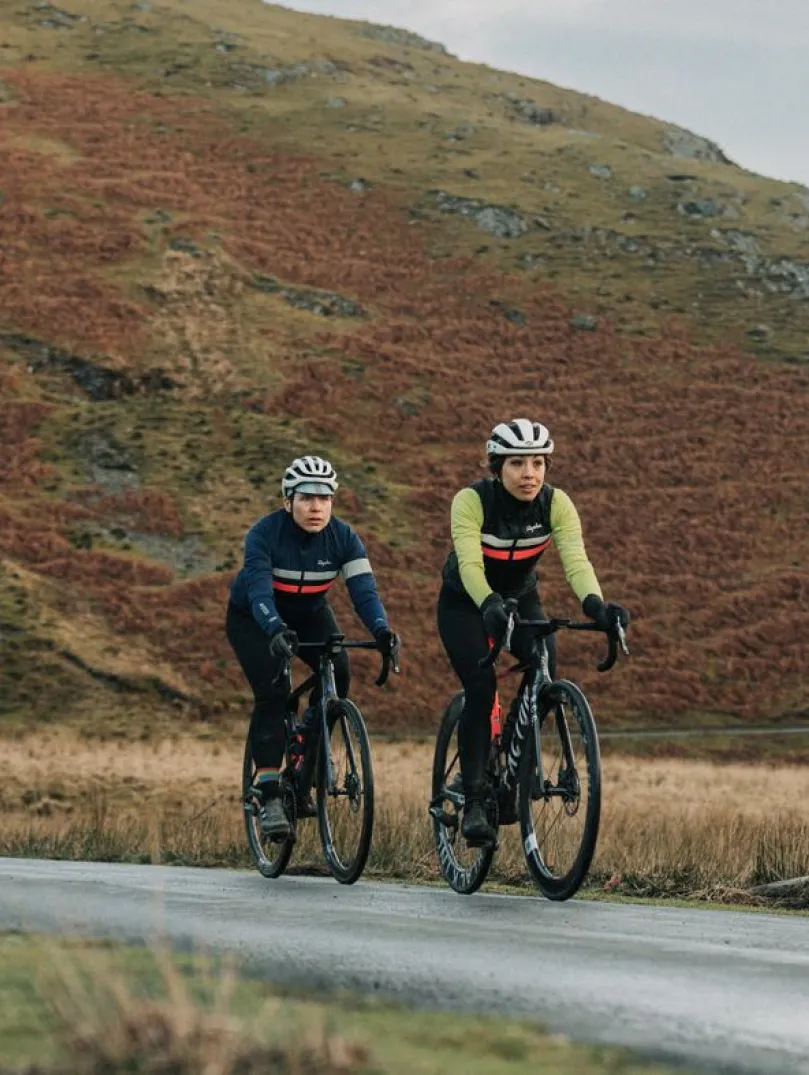Two cyclists on their bikes on a mountain side,