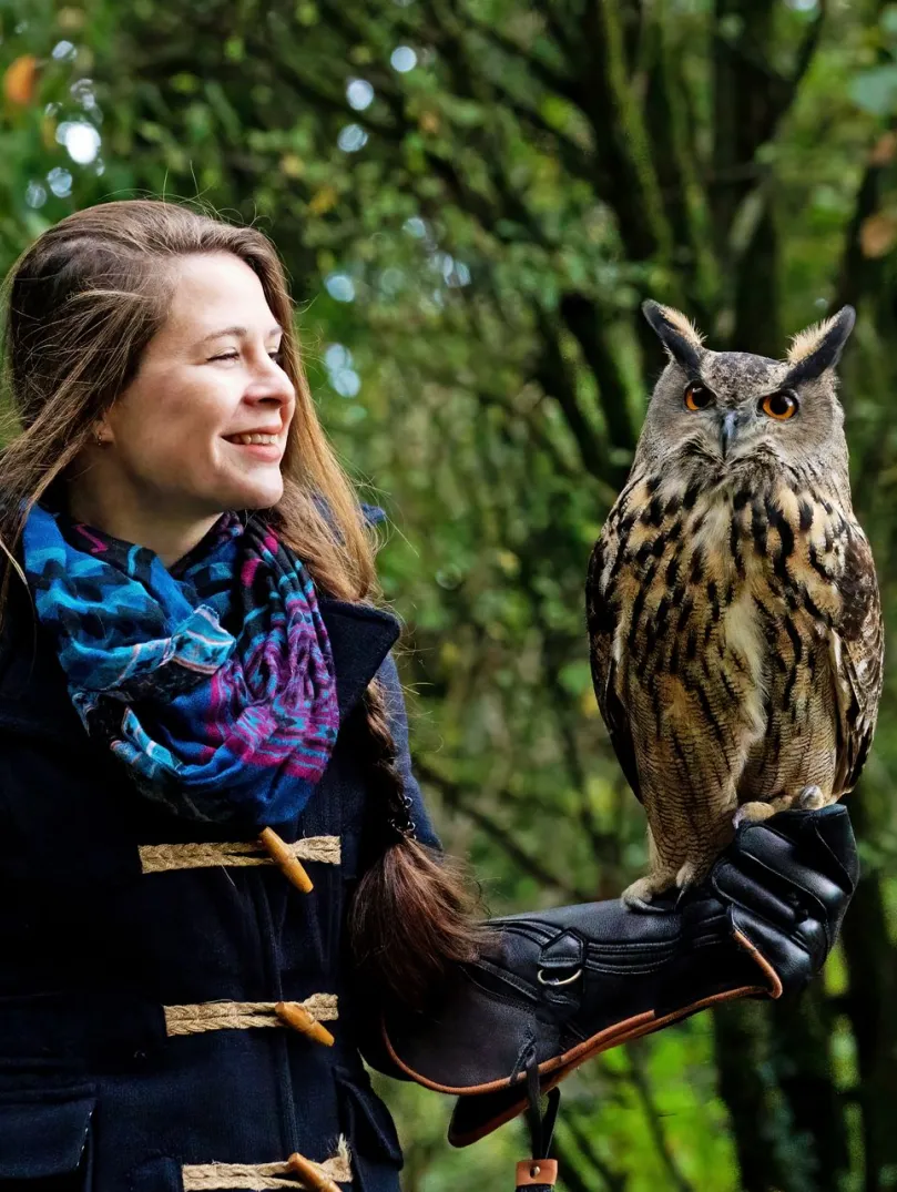 Lady holding an European Eagle Owl