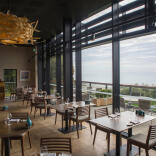 The dining room at Coast Restaurant, Saundersfoot with views of the ocean.