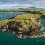 Nefyn golf course surrounded by the sea and mountains.