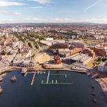 An aerial view of all the attractions and waterfront at Cardiff Bay.