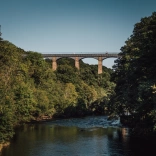 An aqueduct spanning high over a river.