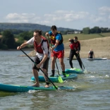 Stand up paddleboarders on the water.