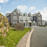A driveway leading toward a hotel.
