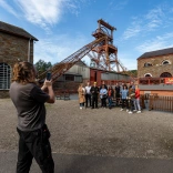 Group posing for a photo outside a coal mining experience.