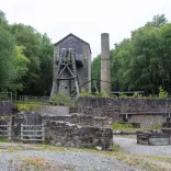 Winding wheel tower and chimney stack at a lead mine.