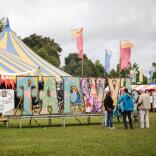 Tafwyl sign and performing tent at the festival.