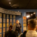 Group of people listening to a tour guide at The Royal Mint.