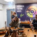 Group of people taste testing on a distillery tour.