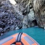 A boat entering a cave.