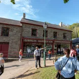 A guide taking a group of people around a history museum.