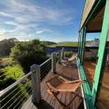 Seating on the balcony of an accommodation with countryside views.