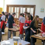 Group of ladies making welshcakes in a workshop.