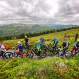 Group of cyclists on eBikes with mountain views beyond