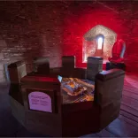 A round table showing a virtual castle in a castle tower.