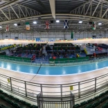 Widescreen shot of a velodrome track.