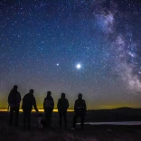 Group of people stargazing.