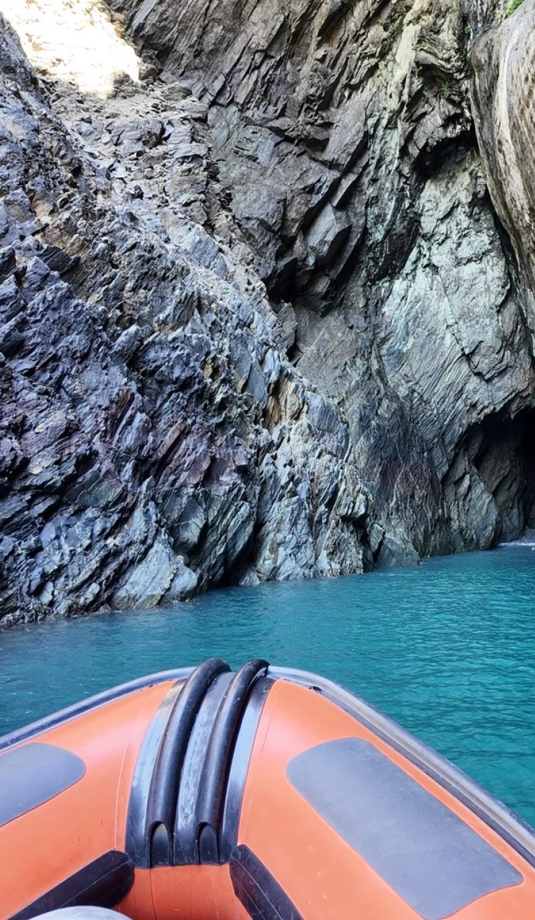A boat entering a cave.