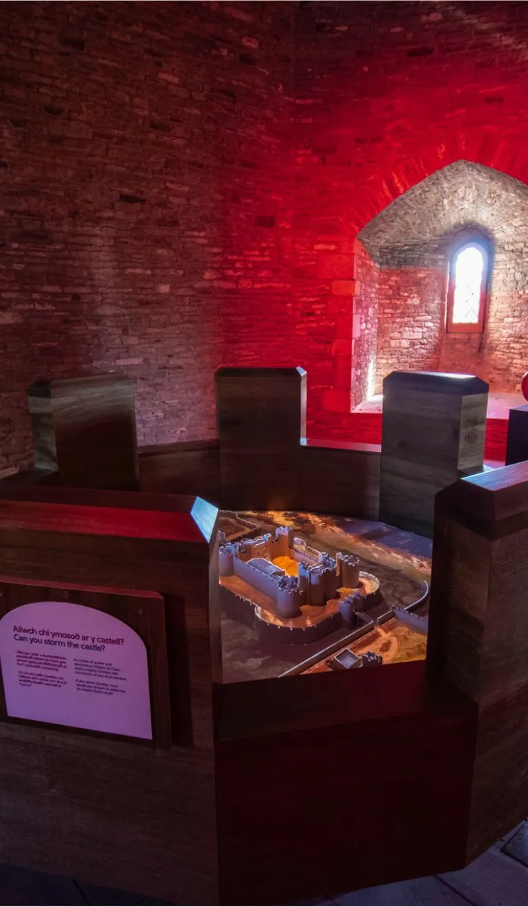A round table showing a virtual castle in a castle tower.